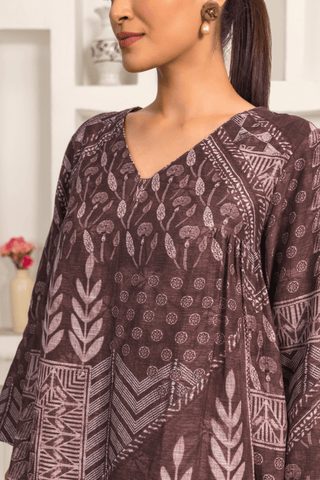 Closeup view of woman is wearing a Brown printed linen cord set with intricate white patterns, paired with matching printed pants