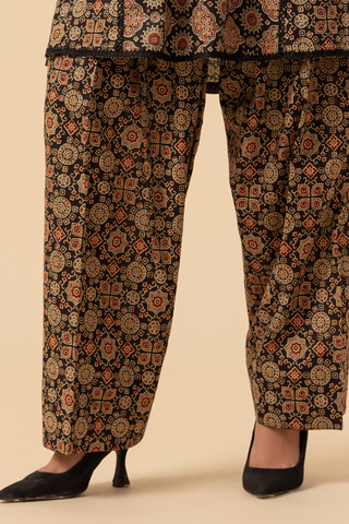 Closeup view of ajrakh printed co-ord set with pants on a beige background