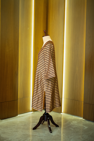 side view of black and gold striped kurta paired with a sheer