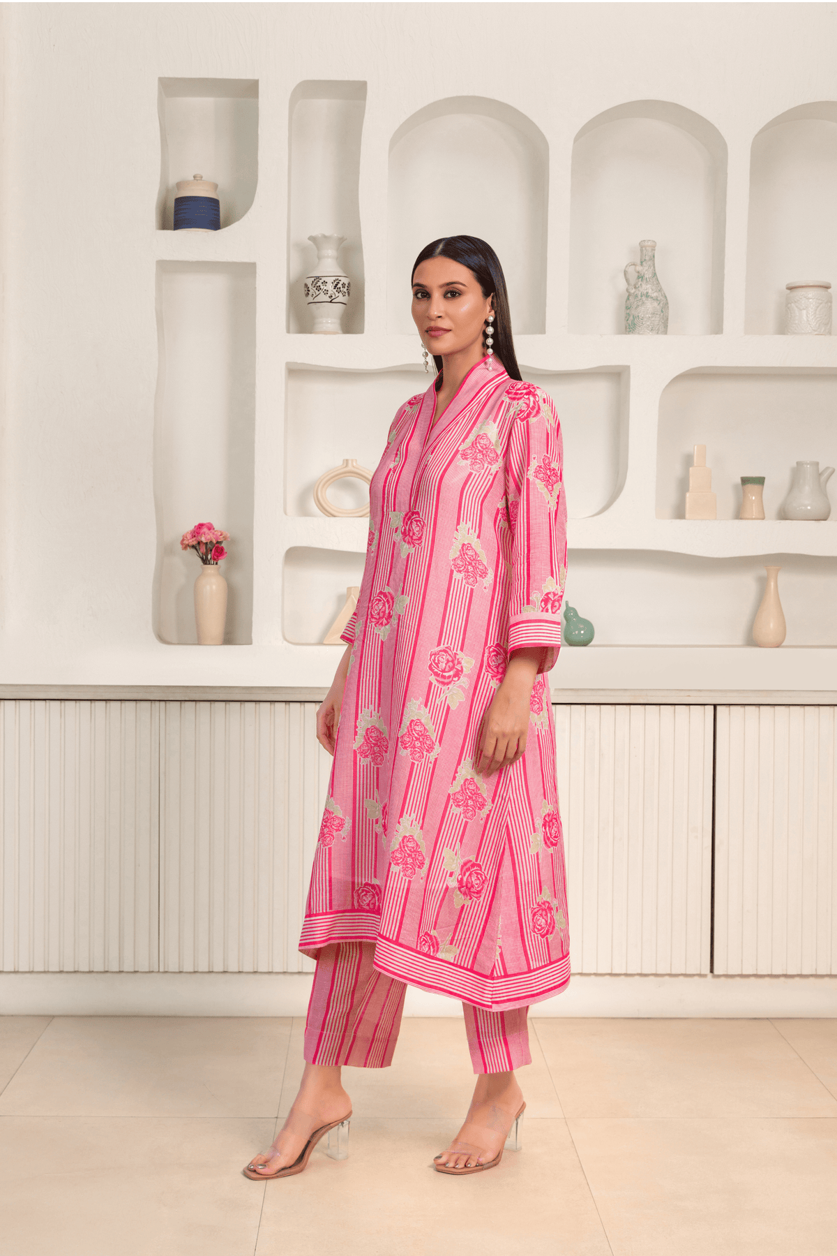 A women wearing pink floral printed kurta set with a contemporary design