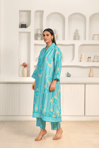 A women wearing blue floral printed kurta set with a contemporary design