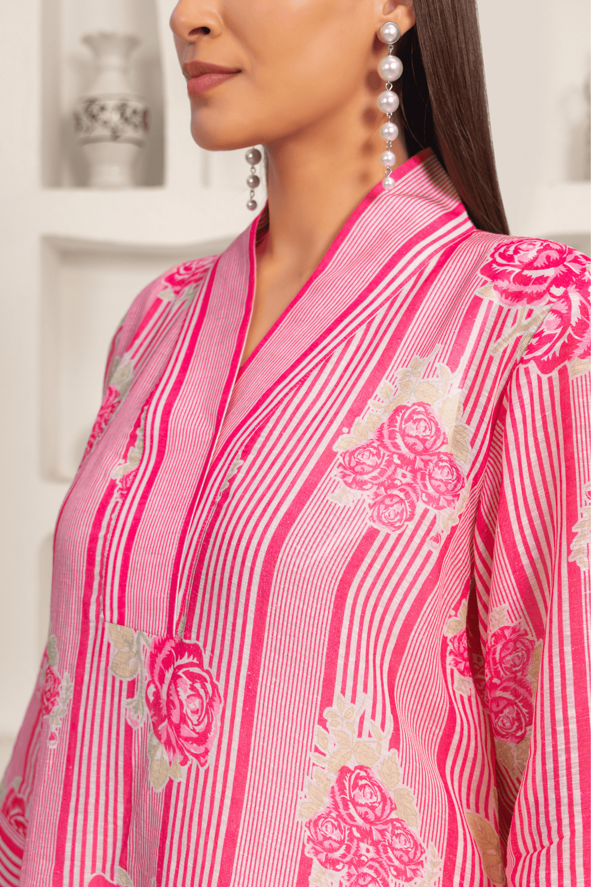 Close up view of women wearing pink floral printed kurta set with a contemporary design