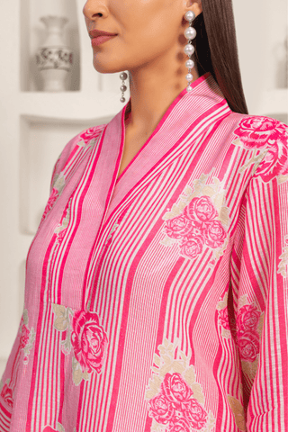 Close up view of women wearing pink floral printed kurta set with a contemporary design